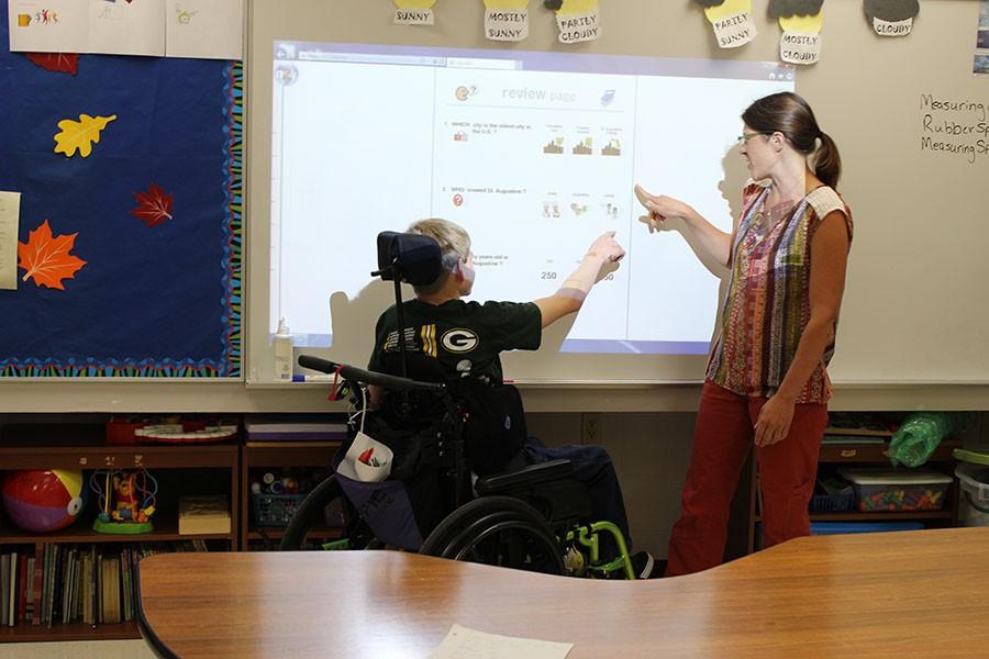 Ms. Brown teaches student Foster Klein in one of the special education classrooms. SNAP aims to create more friendships and more inclusion for special needs students at North. 