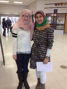 Freshman Zoe Plzak wearing a hijab with freshman Salma Abdel-Azim, one of the World Hijab Day demonstrators.