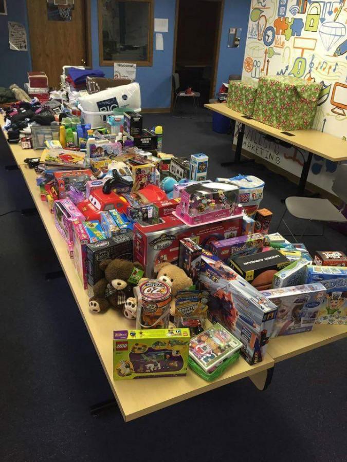 A tabled filled with gifts donated by attendees have been sent to families in need across the Fox Valley