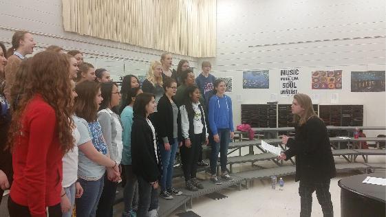 Appleton North senior Jack Russell helps the Varsity Women’s Choir find their pitch during a pre-concert rehearsal.