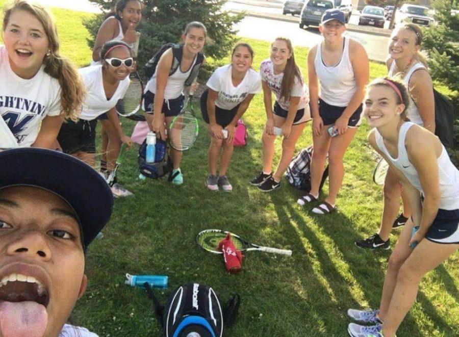 The tennis team taking a selfie during a match. Photo courtesy of Adithi Reddy.