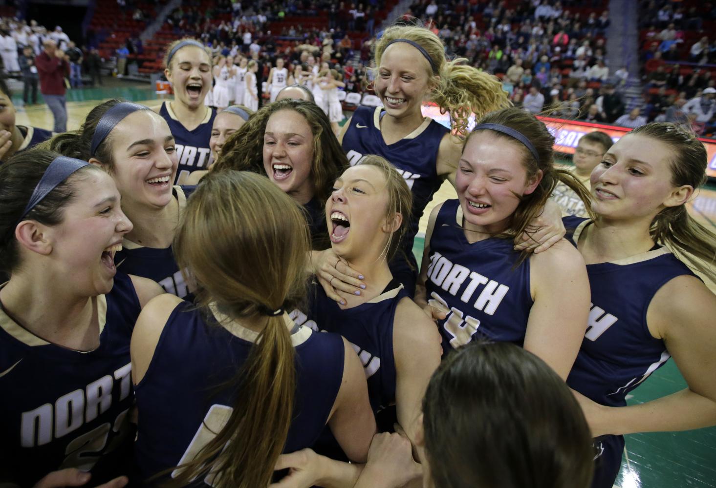 The Lady Lightning celebrating their state championship as the buzzer sounds.