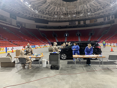 The National Guard helps facilitate Covid-19 testing at the Resch Center, where a large spike in cases has recently been recorded in Green Bay. (Photo credit: Meghan Skrepenski)